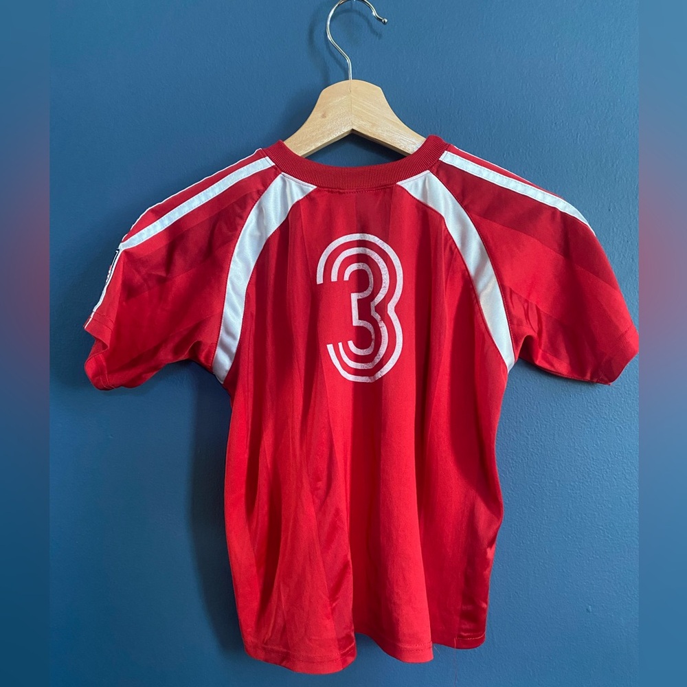 Boys red Adidas soccer jersey